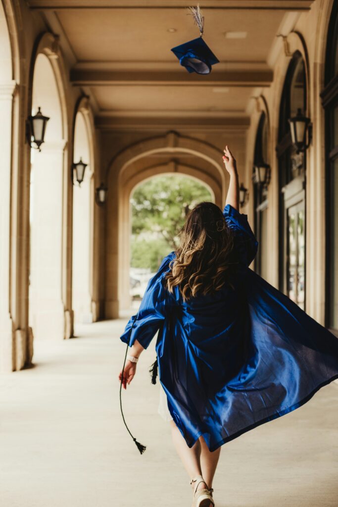 College Student on Graduation Day throwing cap